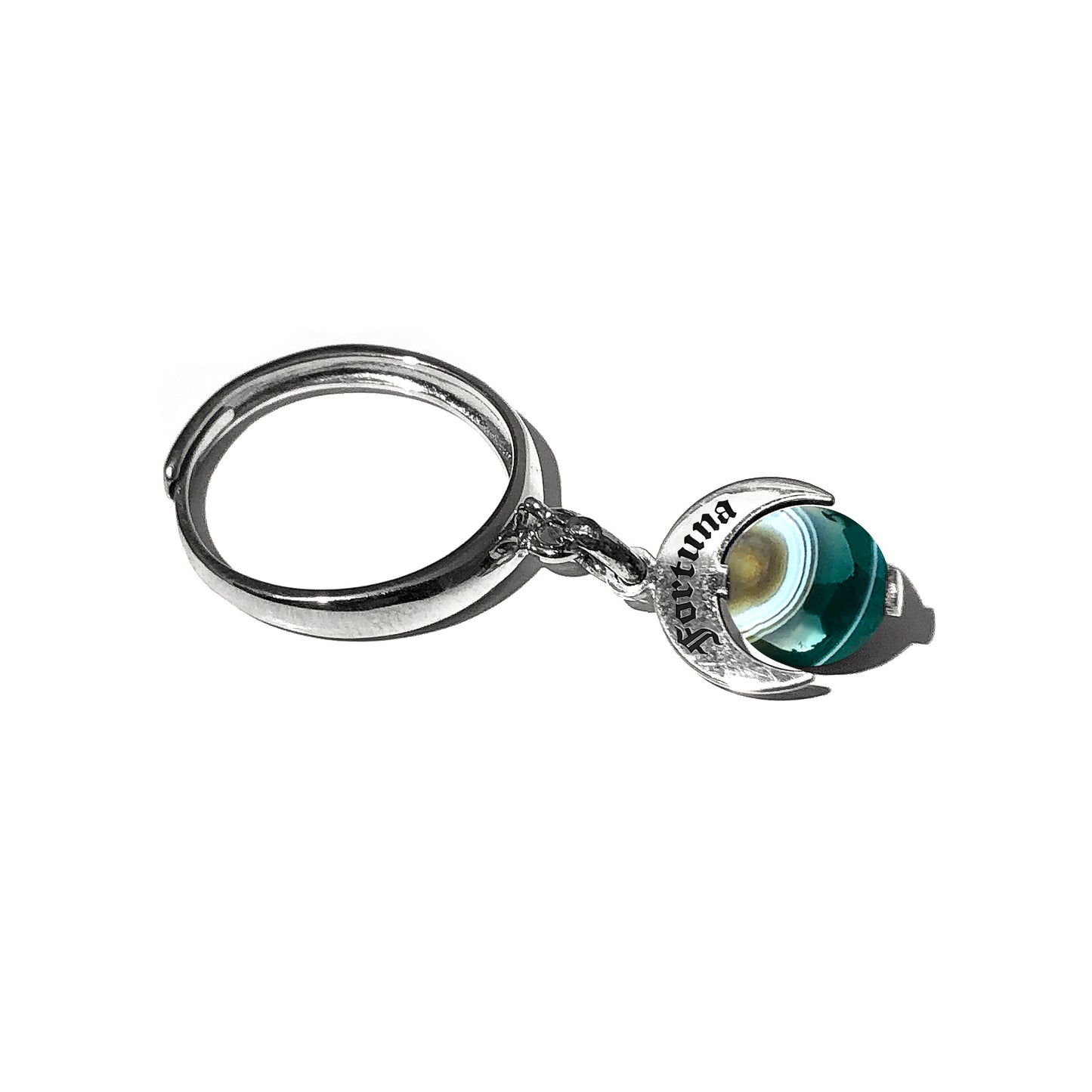 Caratteristiche: L'anello è composto da una base in Argento 925 e un Charm Naja. Quest'ultimo è inciso e smaltato, con scritte in carattere gotico e una Pietra Dura. Il Charm è attaccato alla base dell'anello con un piccolo moschettone che permette l'eventuale riposizionamento del charm stesso su un bracciale , una collana o un qualsiasi altro supporto